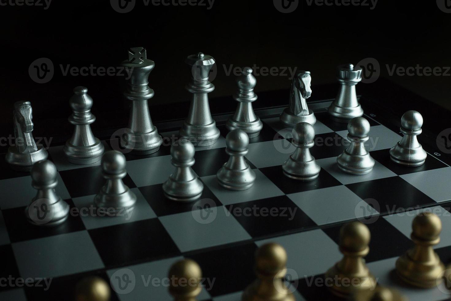 gold and silver chess on board close up image abstract Background. photo