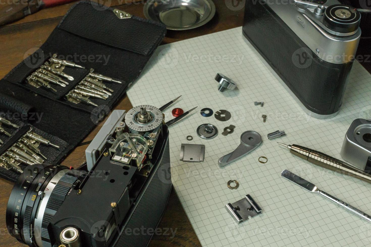 The vintage camera film service, adjustment and alignment. Camera lens repair photo