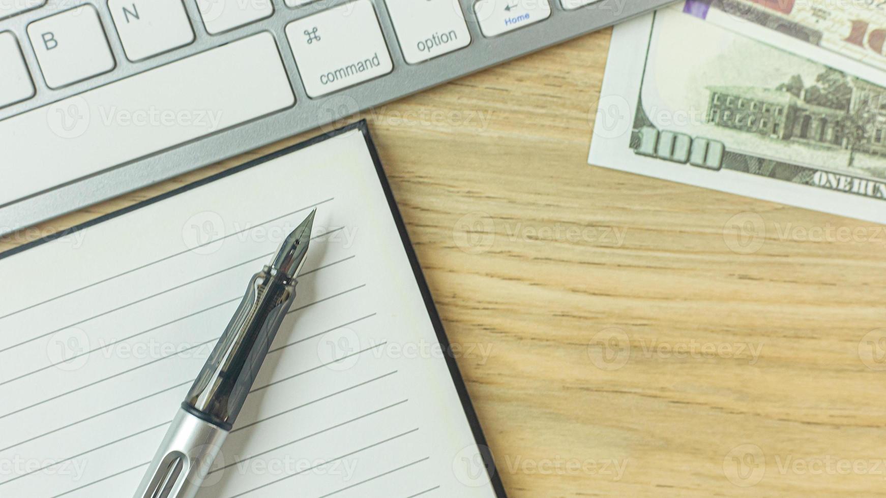 silver pen on wood table for business  content. photo