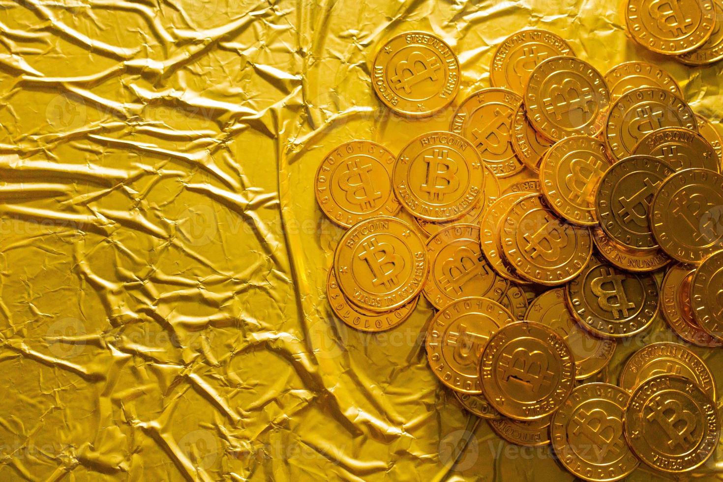 The Bitcoin cryptocurrency in gold texture  image background. photo