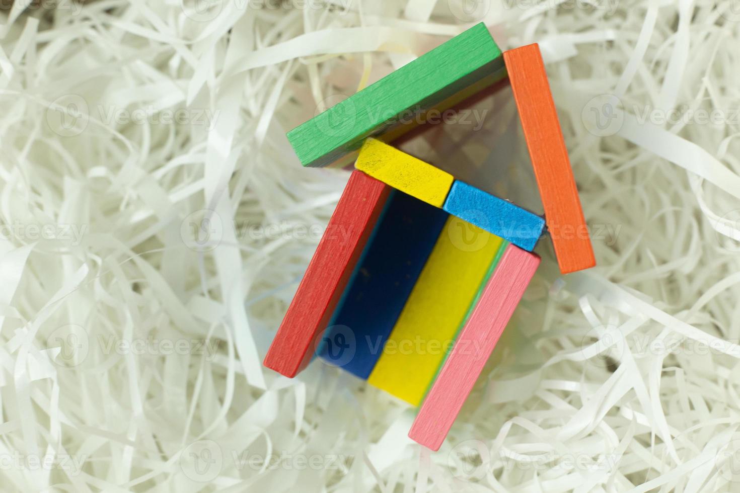 Toy home on Cushioning paper in box for home business content. photo