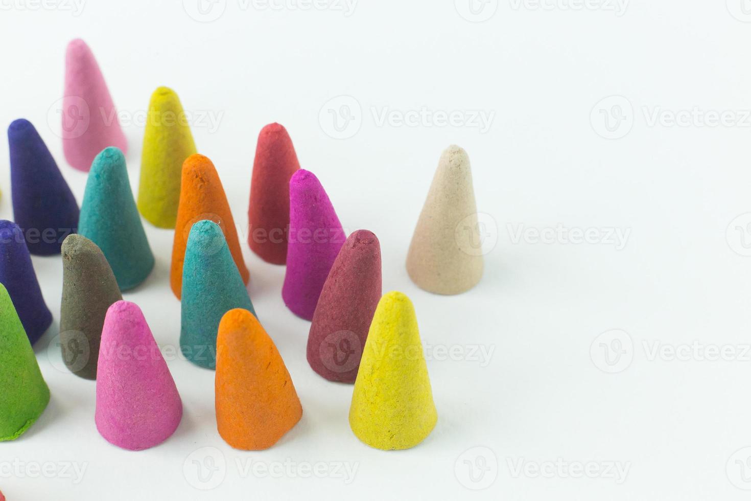 Incense Cone in a stand with the feather for background. photo