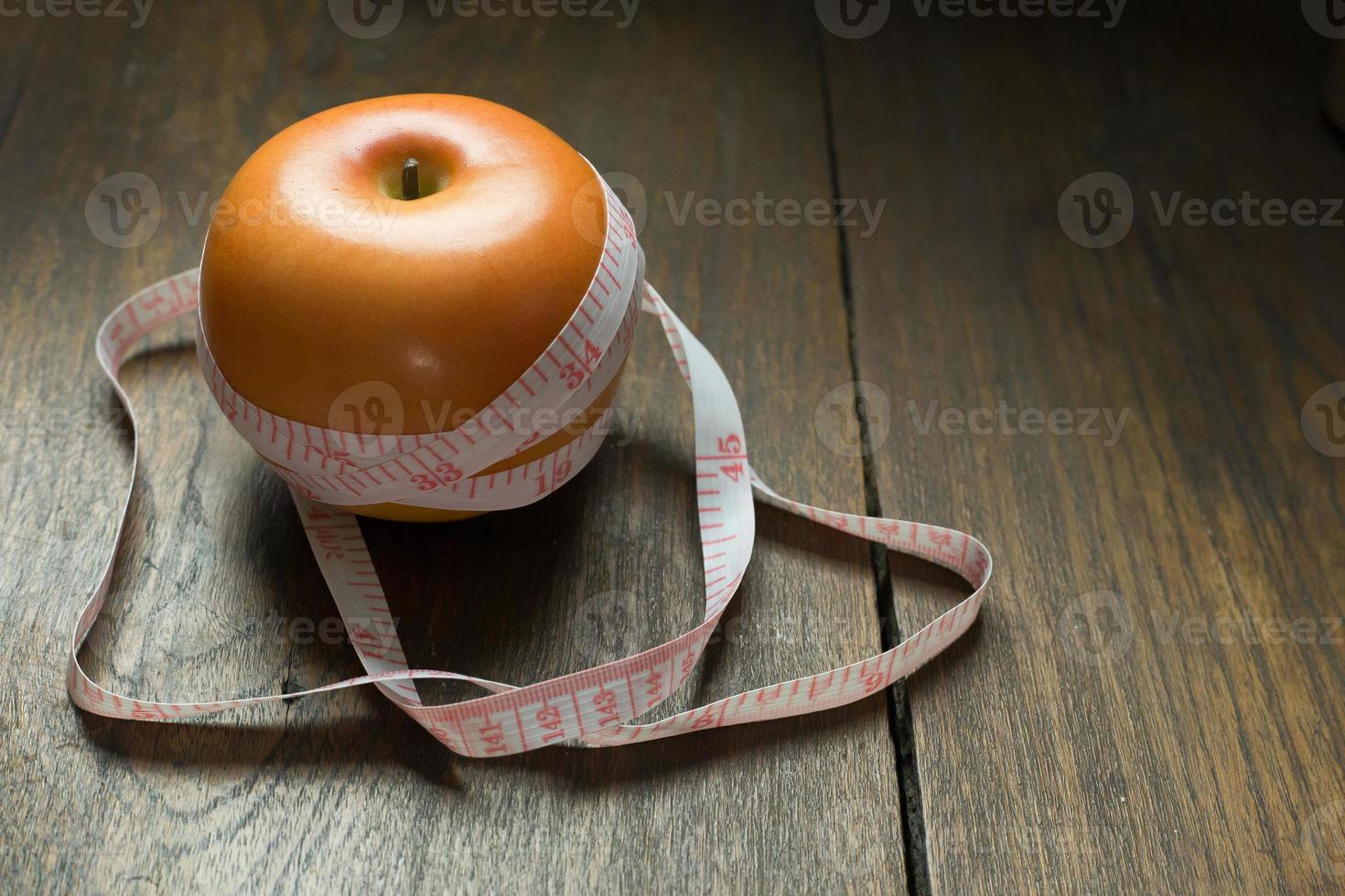 Apple and measuring tape image  for diet content. photo