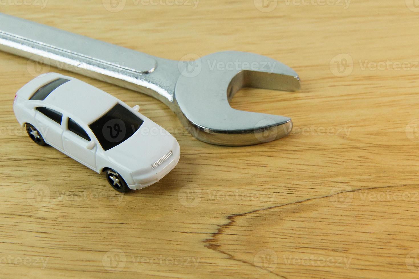 white car toy on wood table  image close up. photo