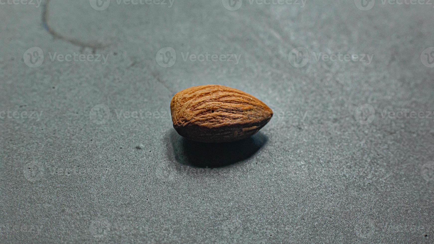The Almond on black Ceramic Plate close up image. photo