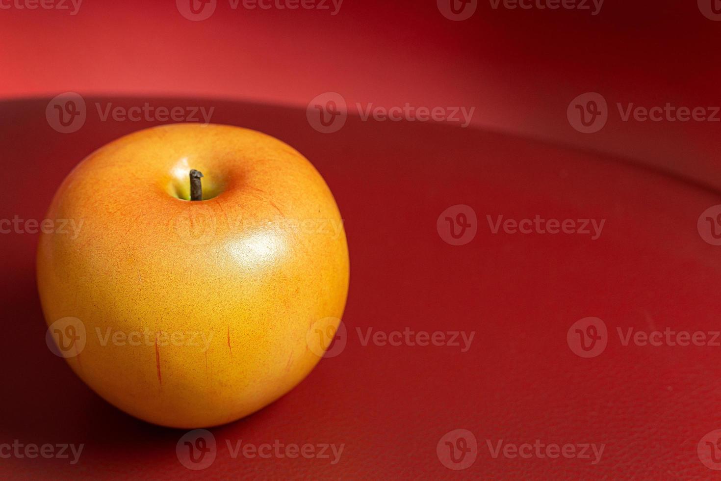 Apple on red background low light for food content. photo