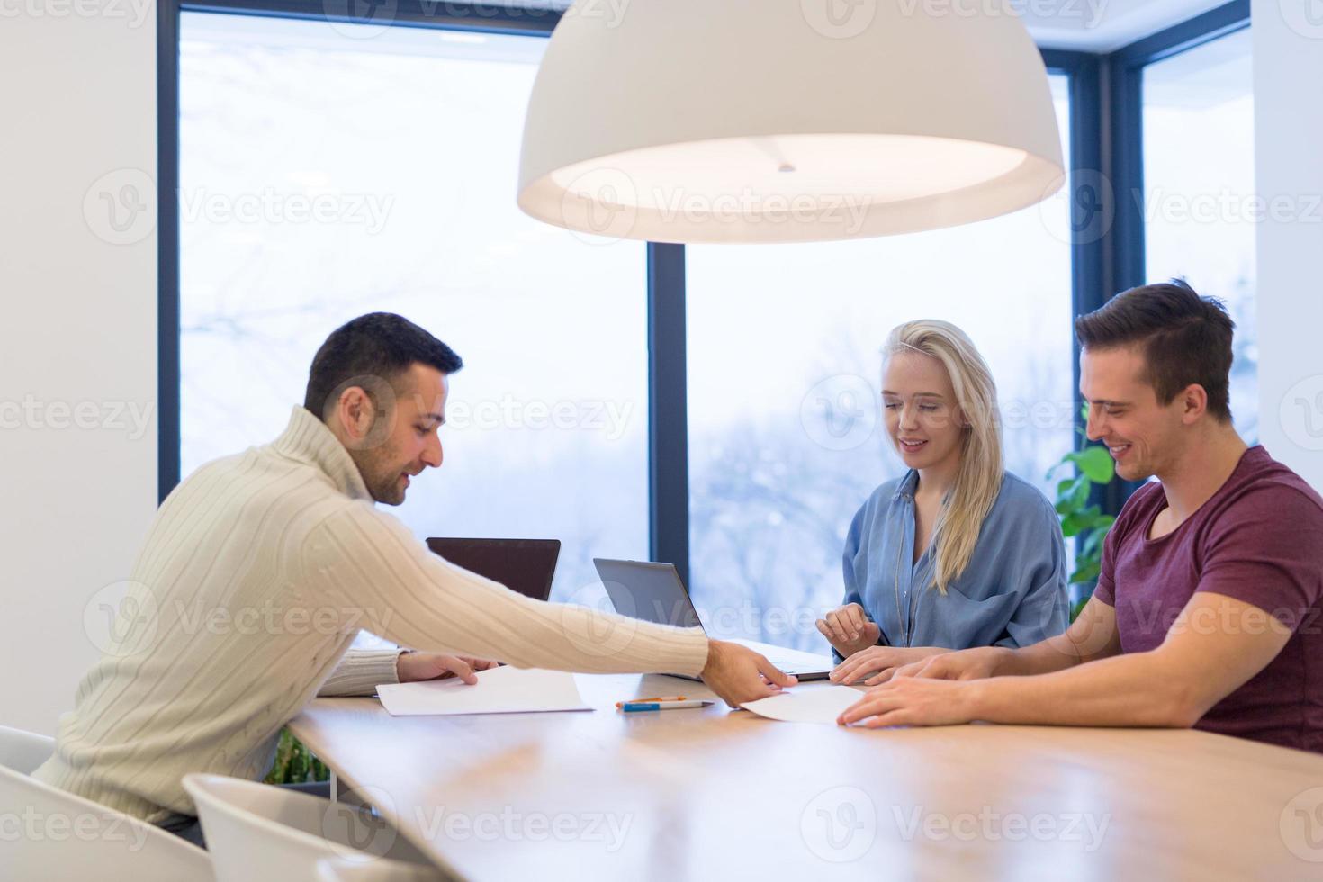 Startup Business Team At A Meeting at modern office building photo