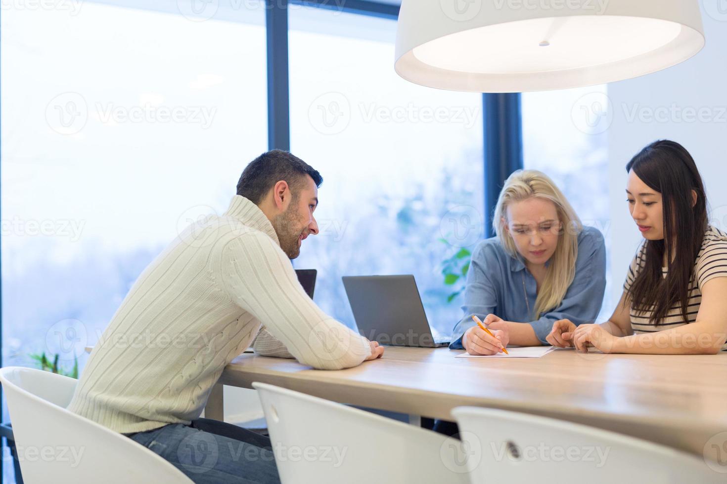 Startup Business Team At A Meeting at modern office building photo
