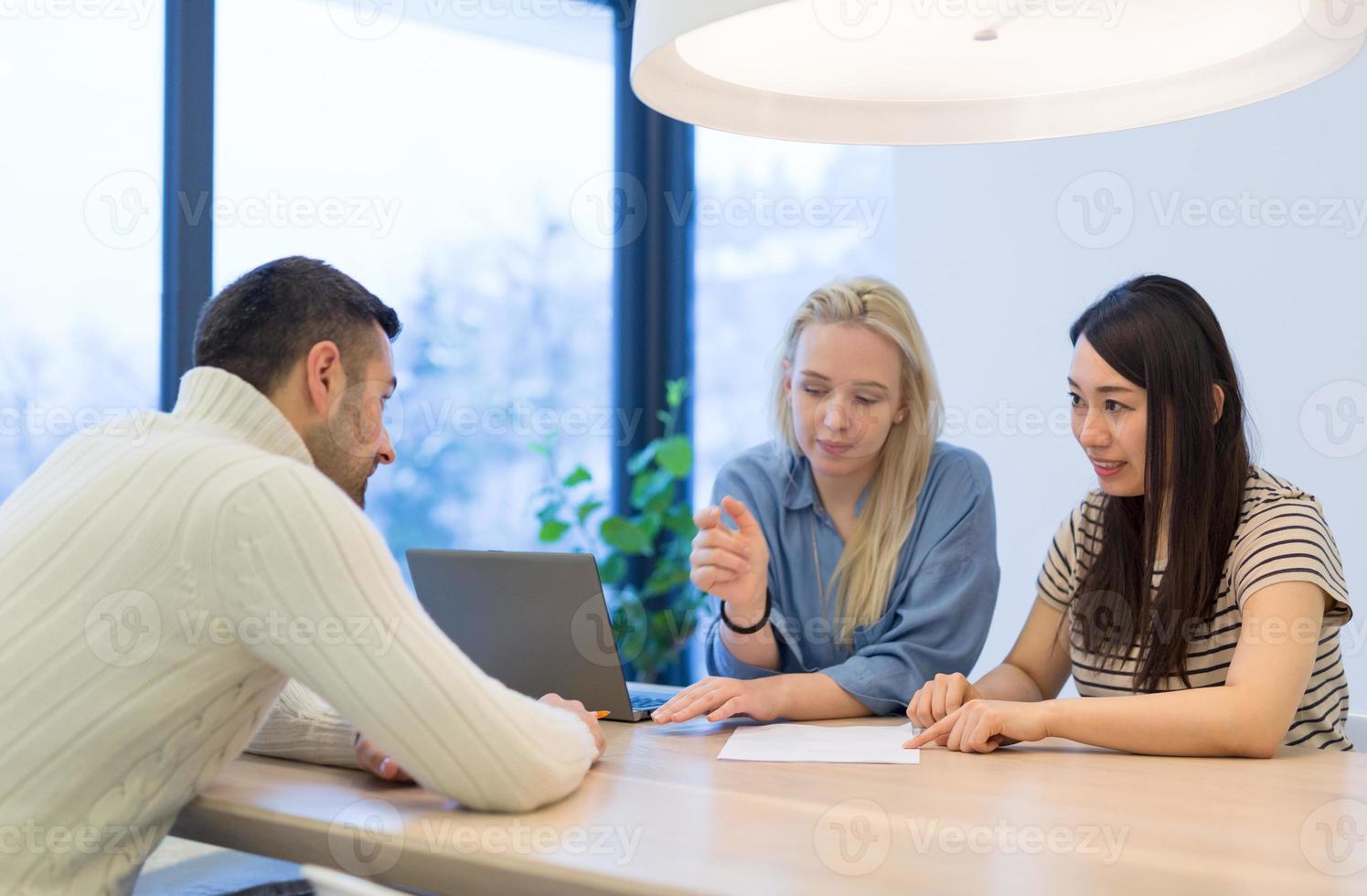 Startup Business Team At A Meeting at modern office building photo