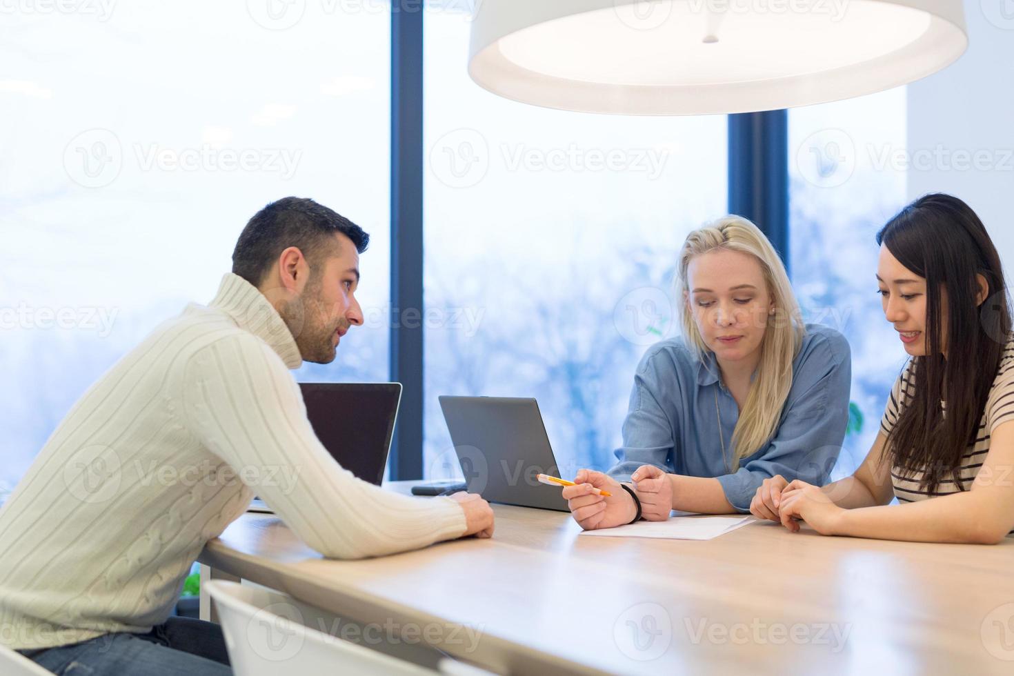 Startup Business Team At A Meeting at modern office building photo