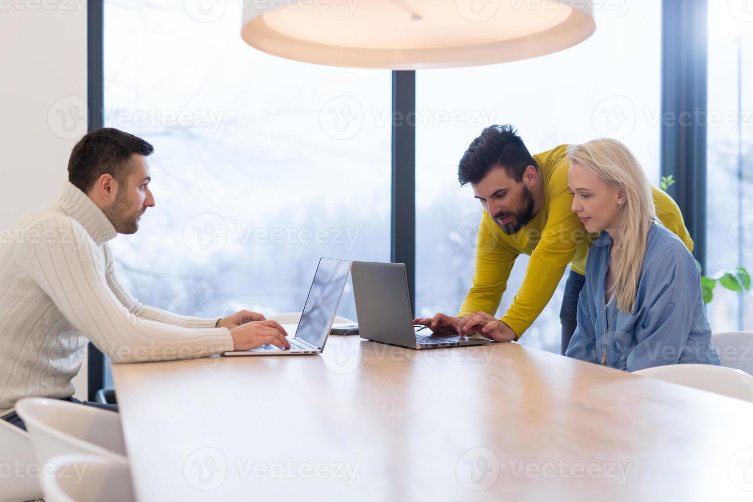 Startup Business Team At A Meeting at modern office building photo