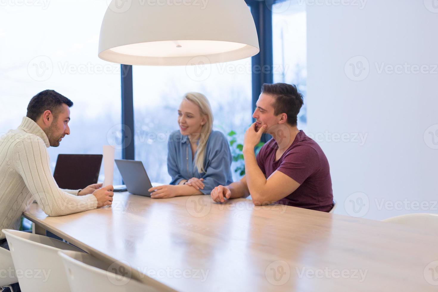 Startup Business Team At A Meeting at modern office building photo