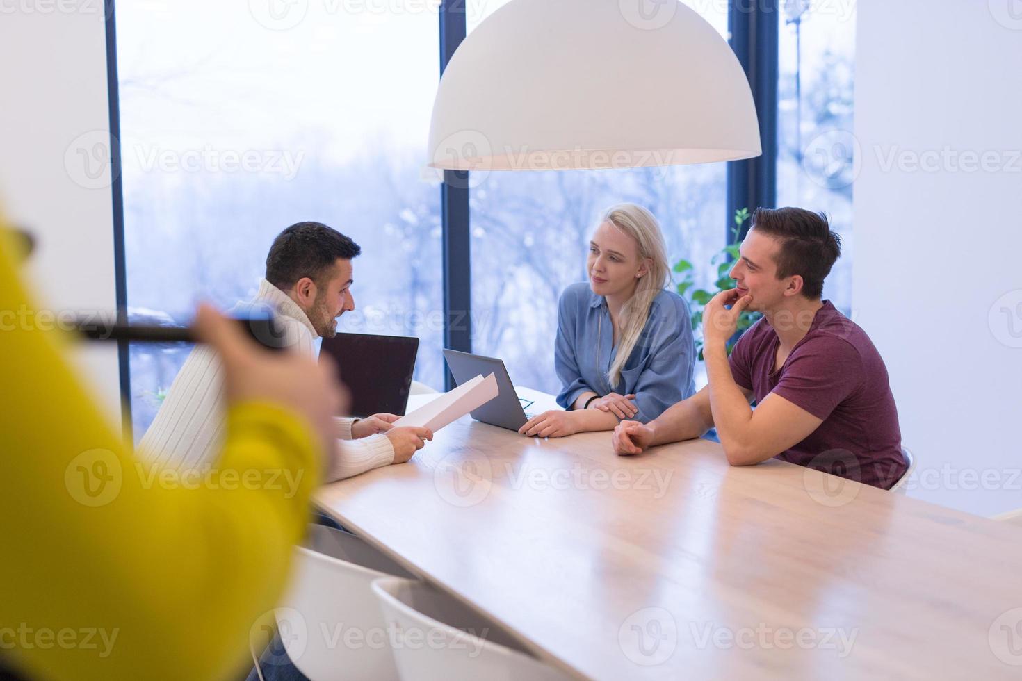 Startup Business Team At A Meeting at modern office building photo