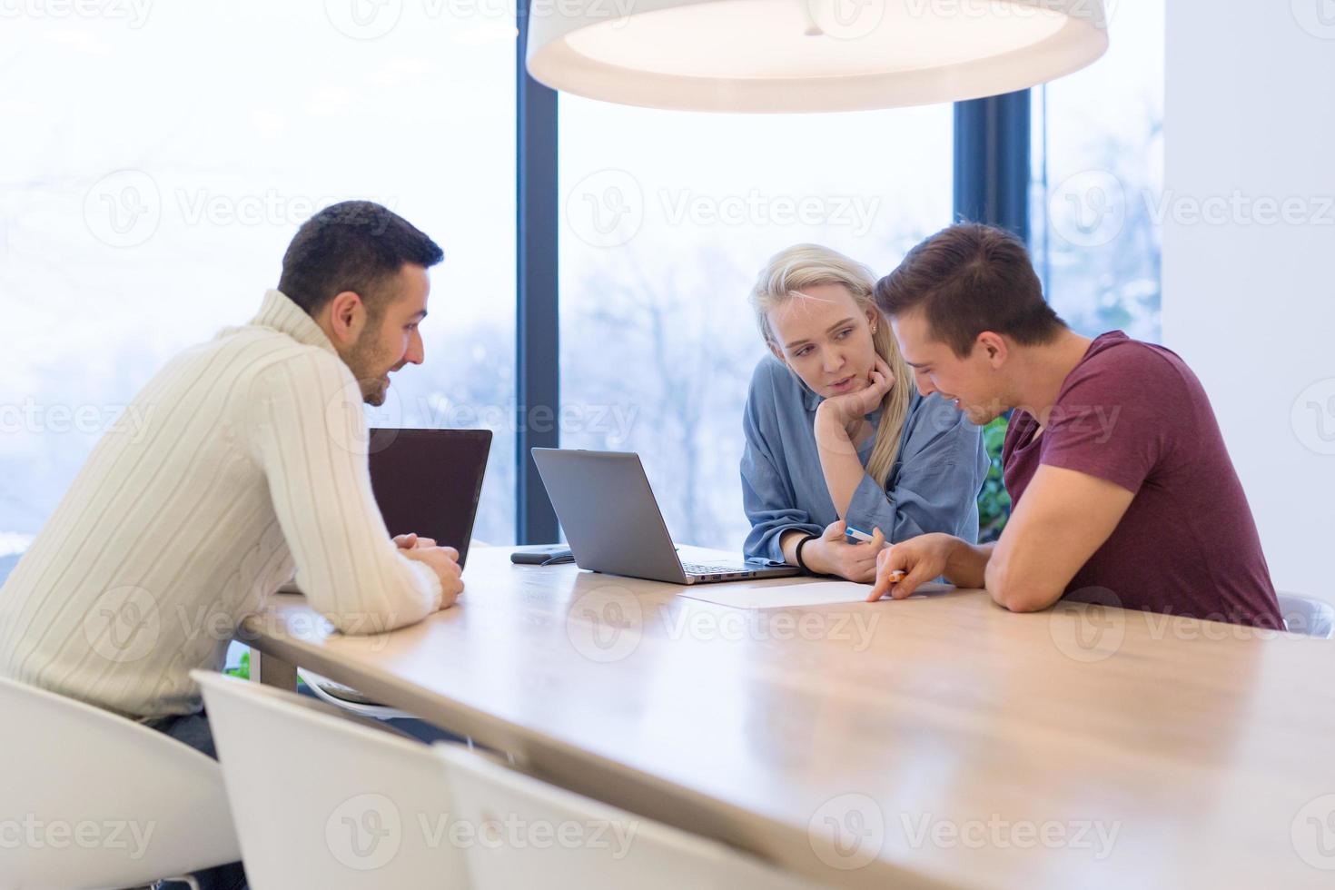 Startup Business Team At A Meeting at modern office building photo