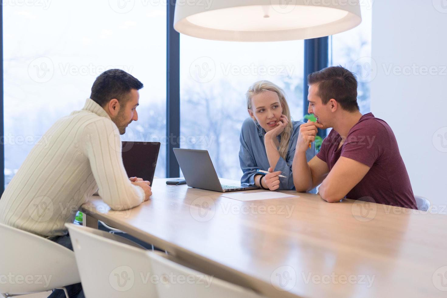 Startup Business Team At A Meeting at modern office building photo