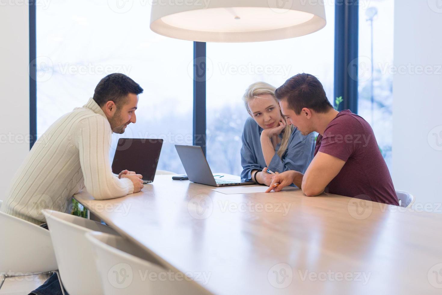 Startup Business Team At A Meeting at modern office building photo