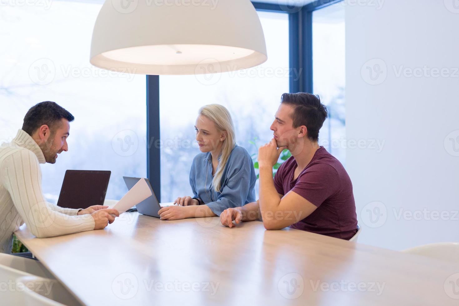 Startup Business Team At A Meeting at modern office building photo