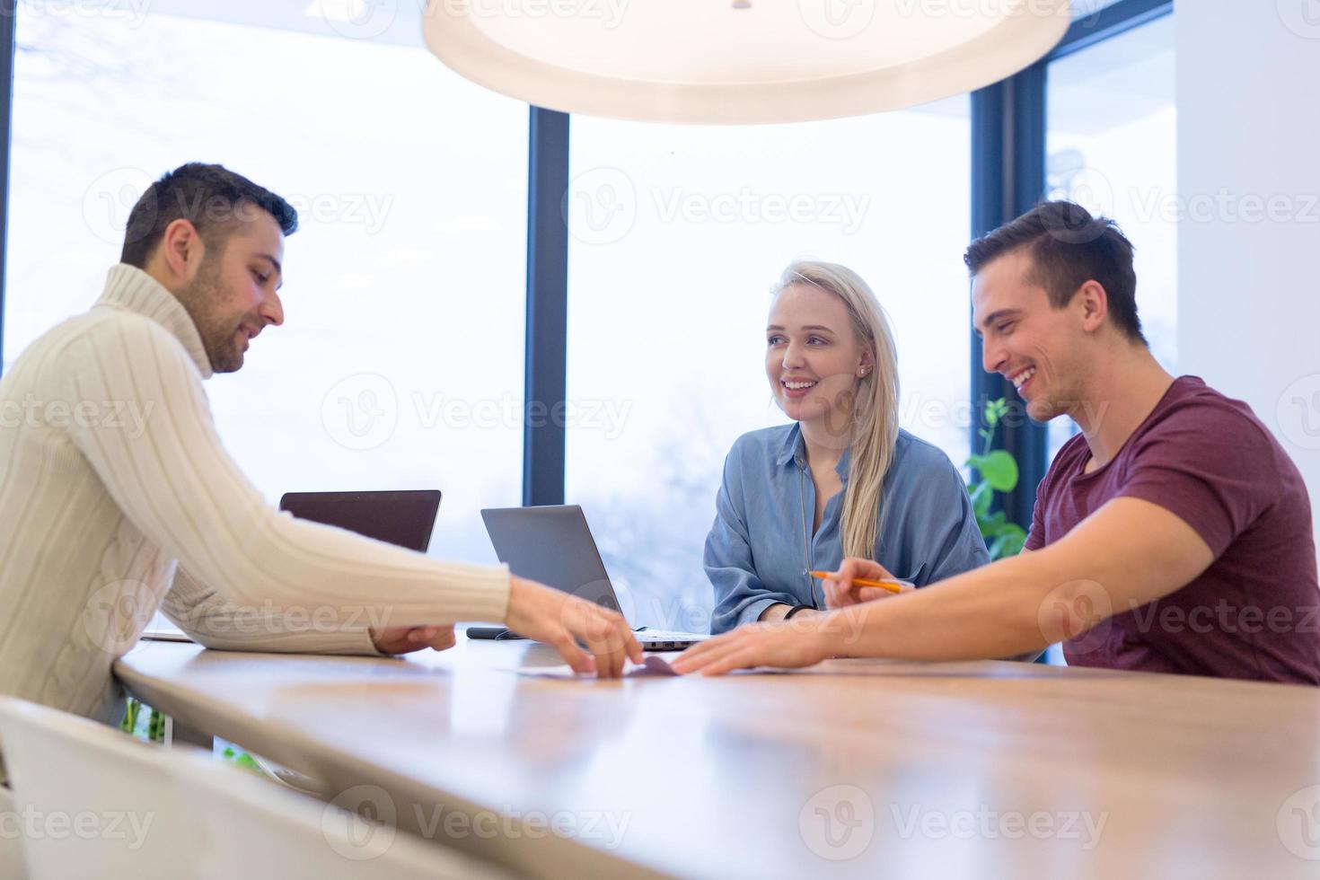 Startup Business Team At A Meeting at modern office building photo