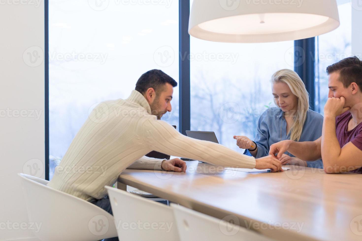 Startup Business Team At A Meeting at modern office building photo