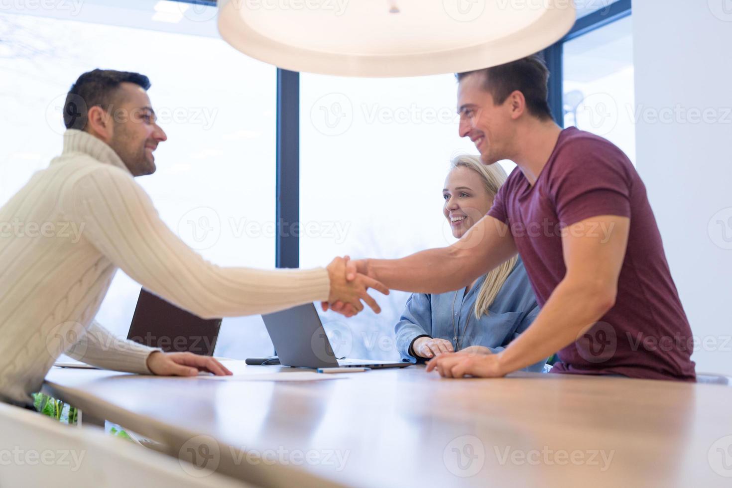 Startup Business Team At A Meeting at modern office building photo