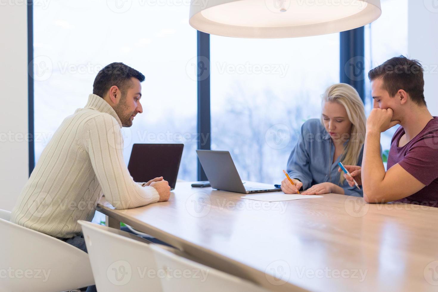 Startup Business Team At A Meeting at modern office building photo