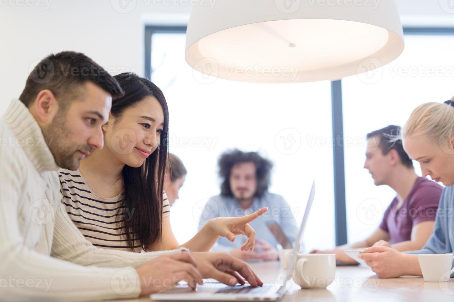 Startup Business Team At A Meeting at modern office building photo