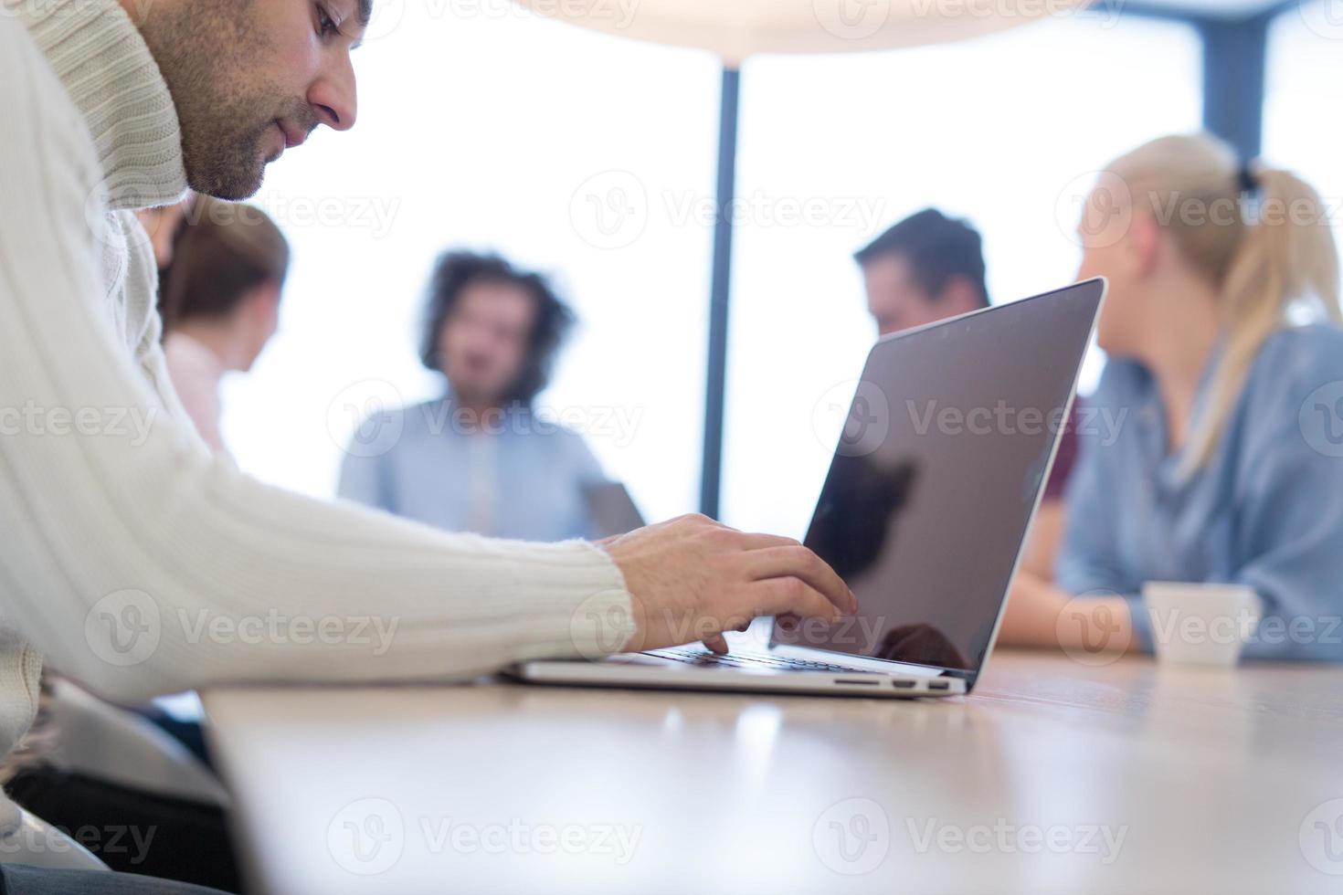 Startup Business Team At A Meeting at modern office building photo