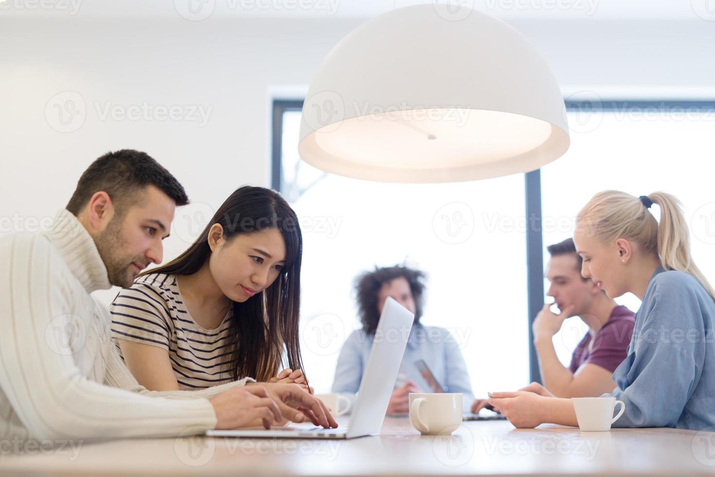 Startup Business Team At A Meeting at modern office building photo