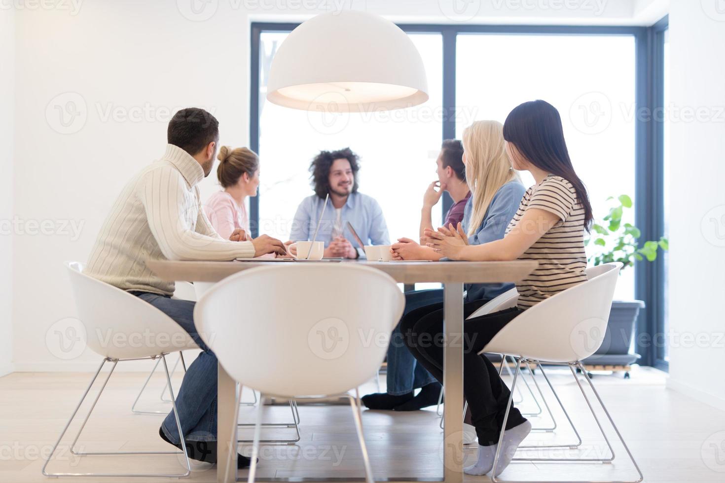 Startup Business Team At A Meeting at modern office building photo