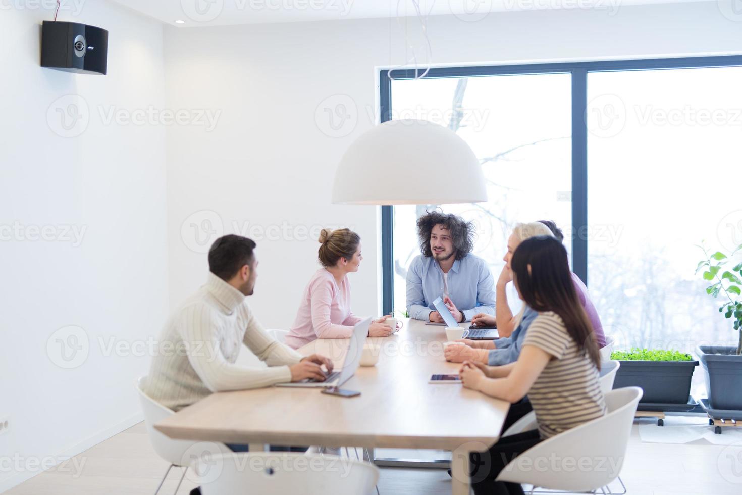 Startup Business Team At A Meeting at modern office building photo