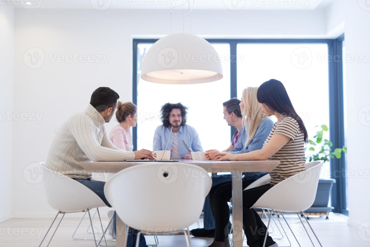 Startup Business Team At A Meeting at modern office building photo