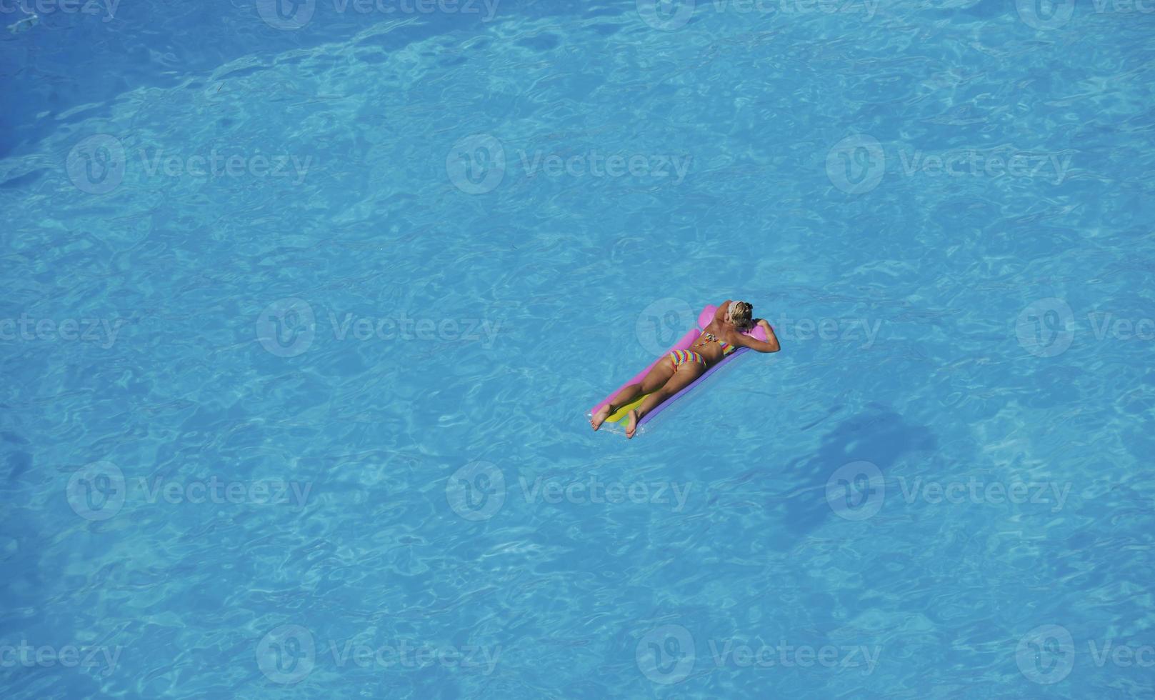 woman relax at swimming pool photo