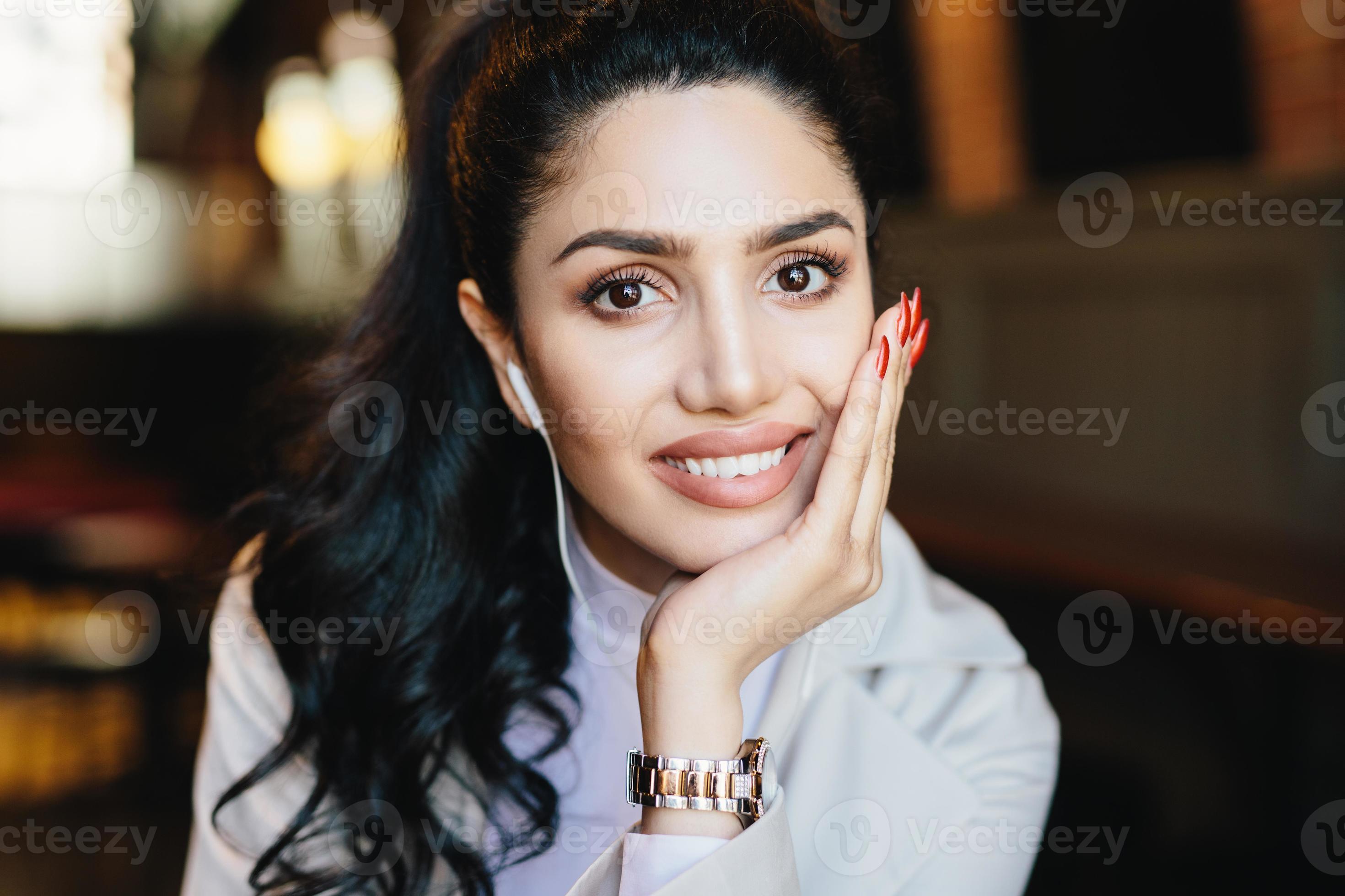 Close up portrait of beautiful female with dark warm eyes