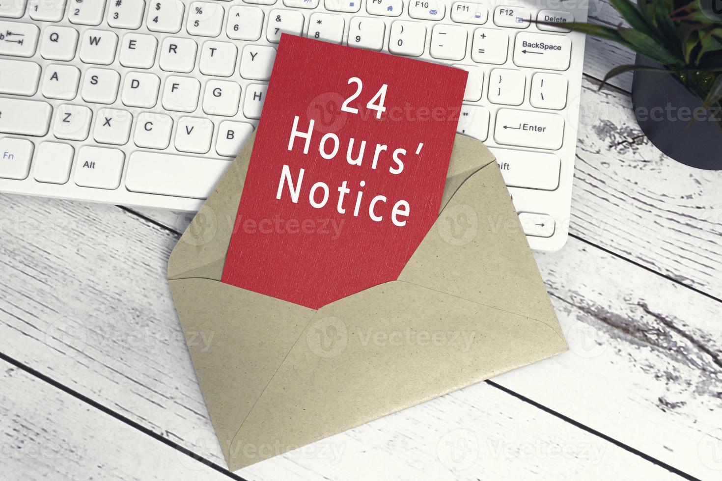 24 hours notice text on red note inside brown envelope. photo