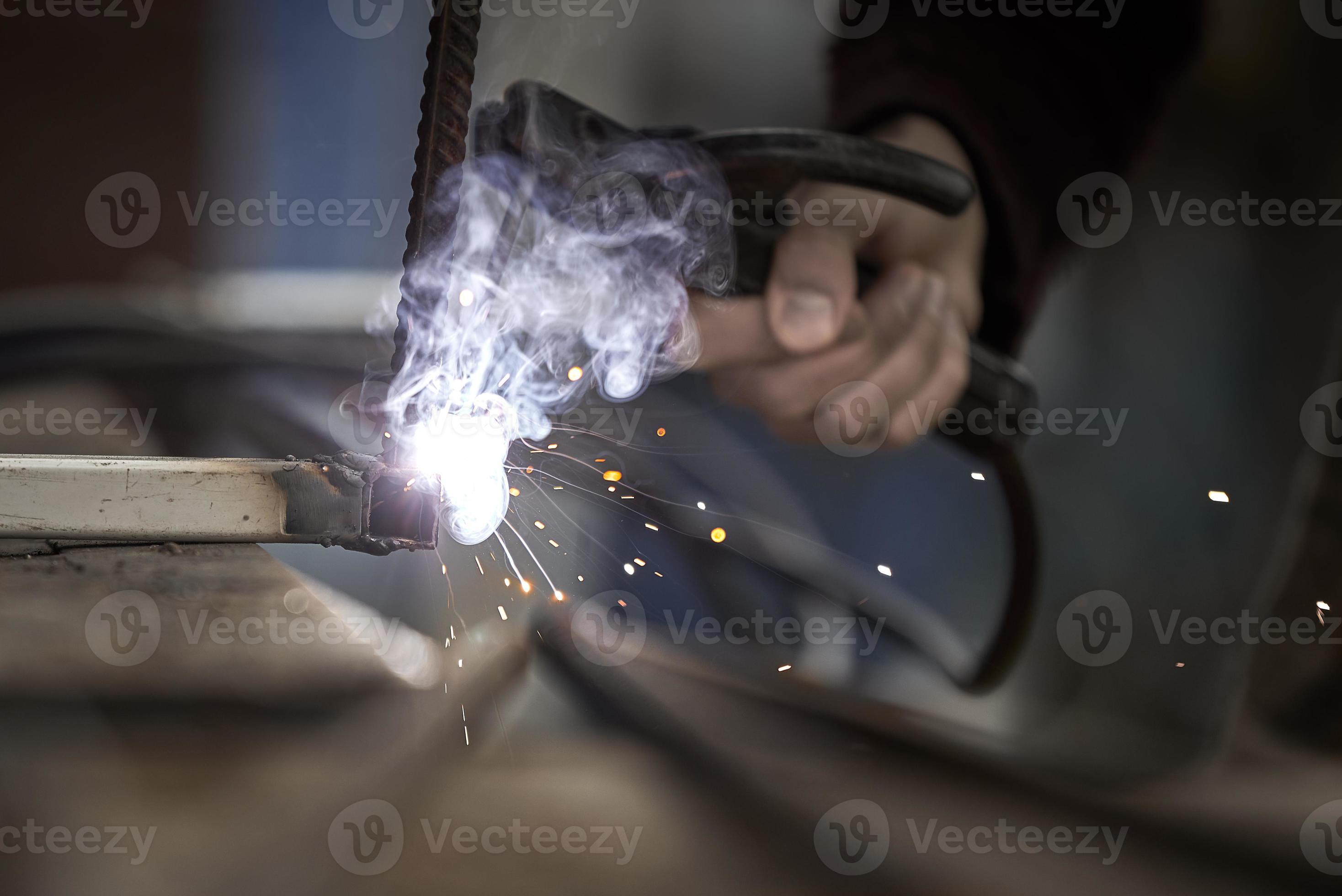 Welding and bright sparks. Hard and dangerous job. 10360955 Stock Photo