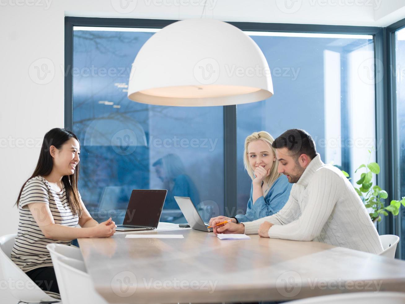 Startup business team at a meeting in modern office building photo