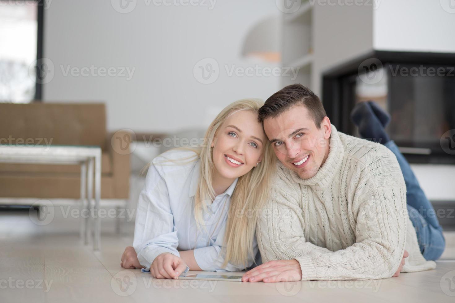 Young Couple using digital tablet on cold winter day photo
