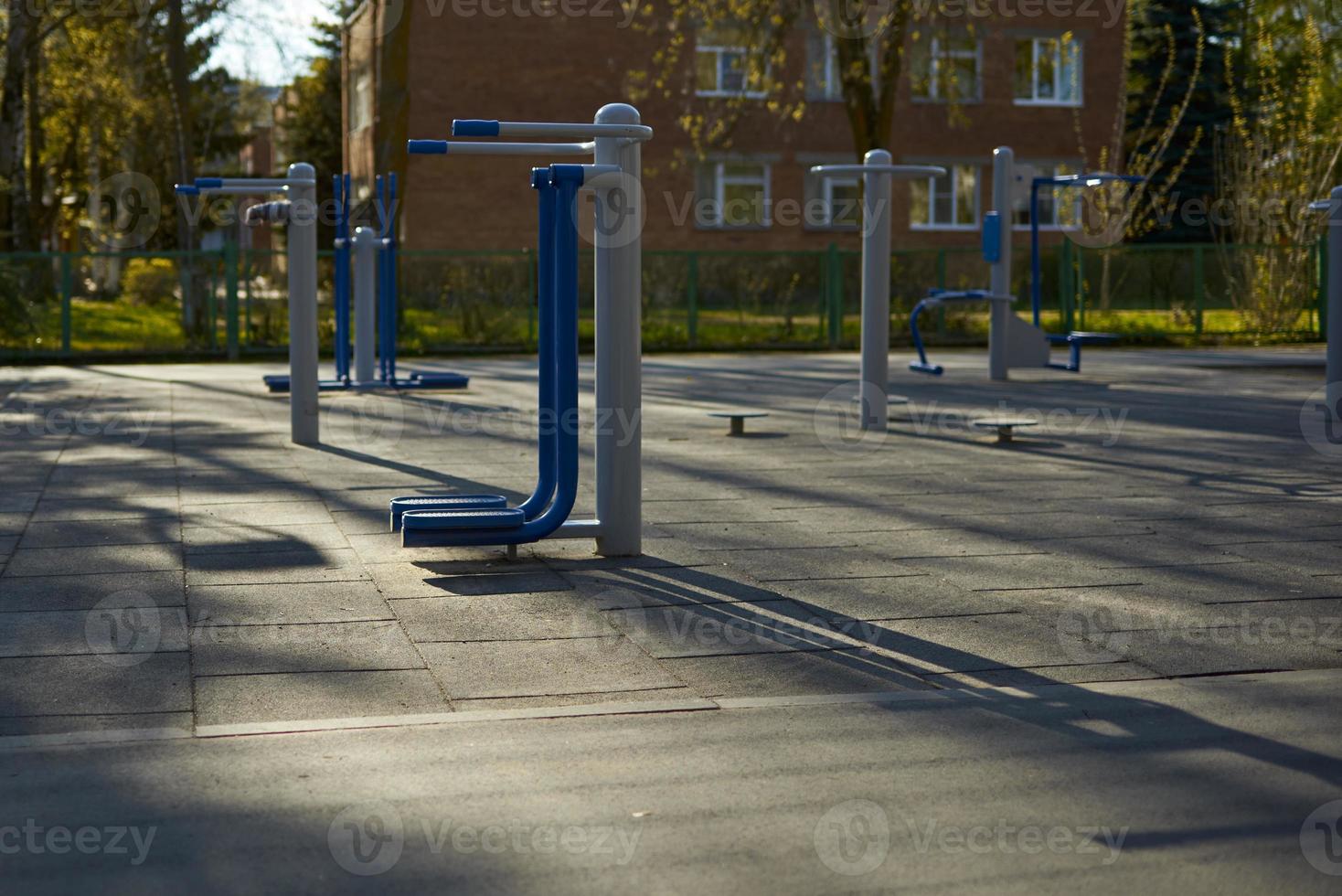 Empty street exercise machines in a public place. The concept of ban on walking. photo
