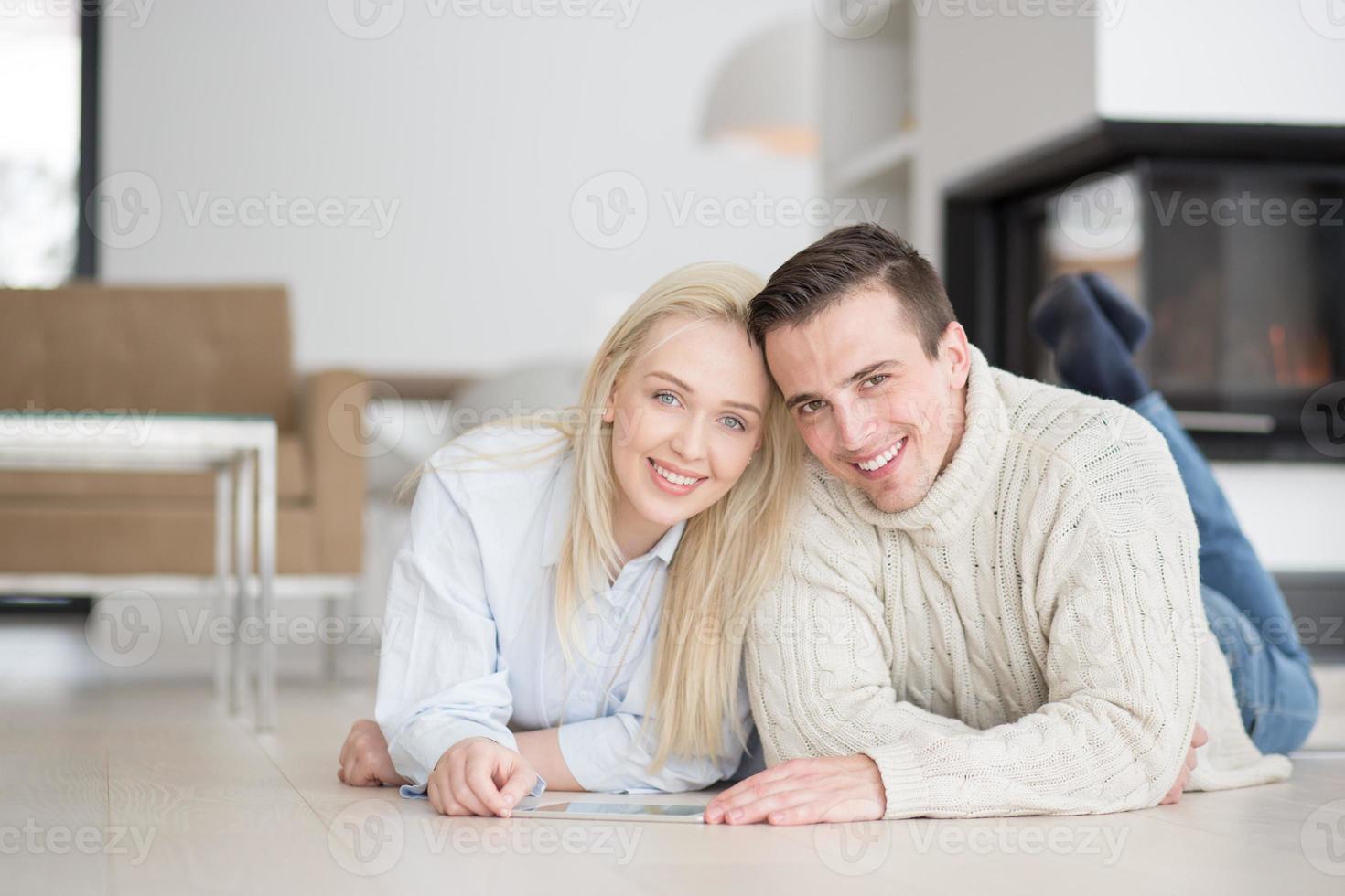 Young Couple using digital tablet on cold winter day photo