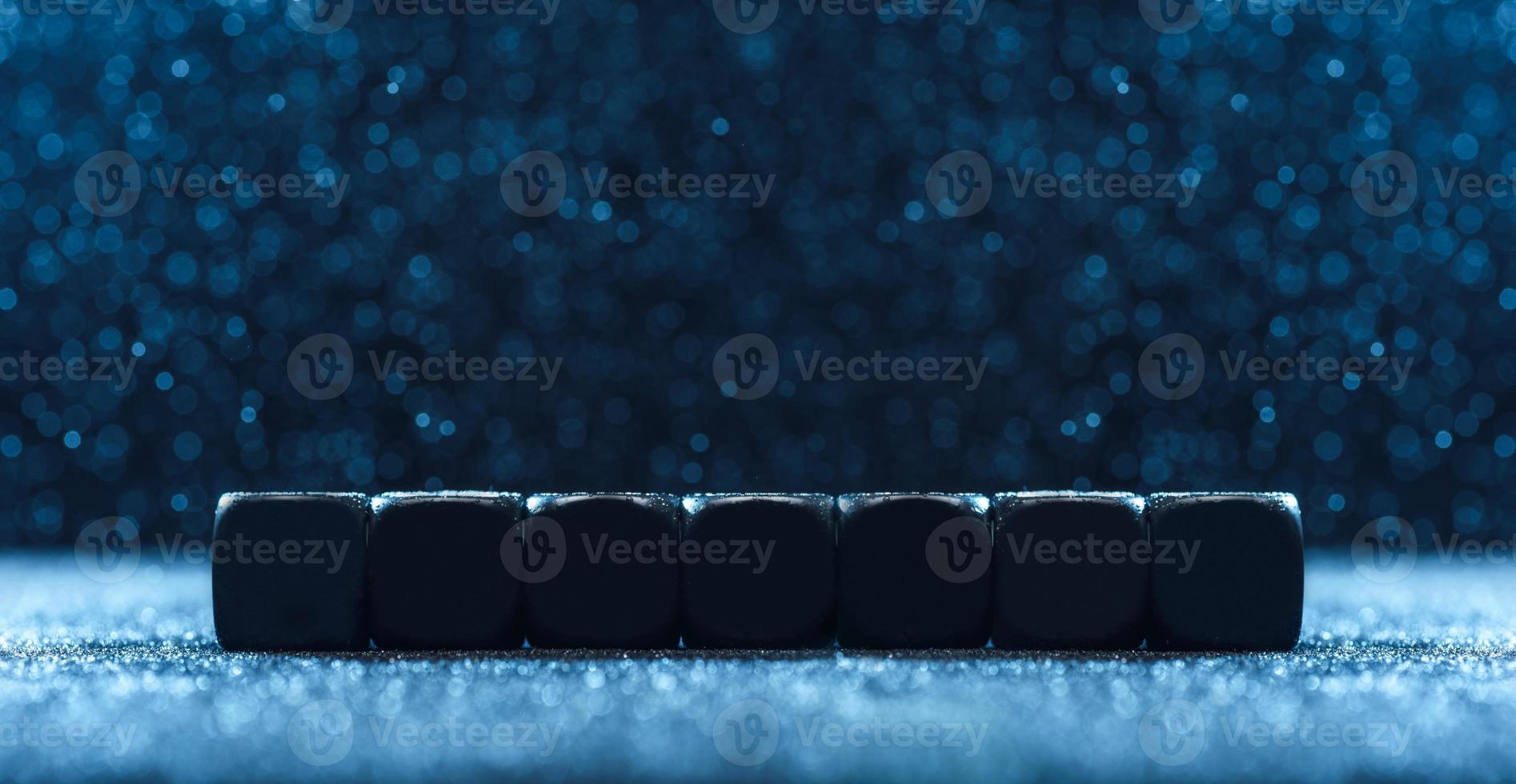 Empty seven dices, on the blue background. Concept for advertising. photo