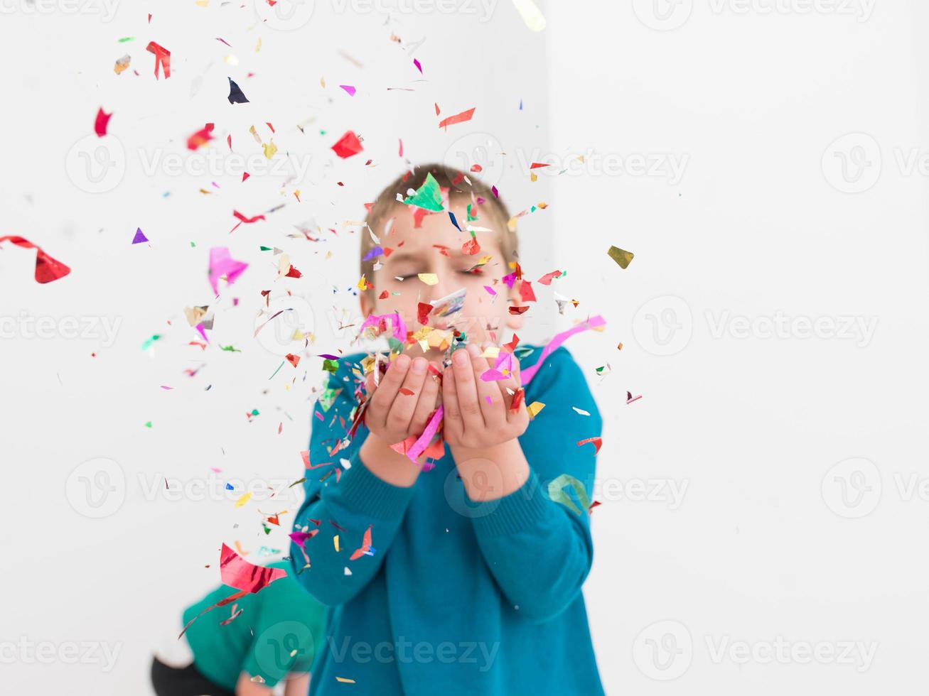 kids  blowing confetti photo