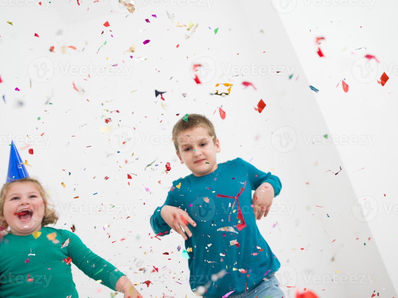 kids  blowing confetti photo