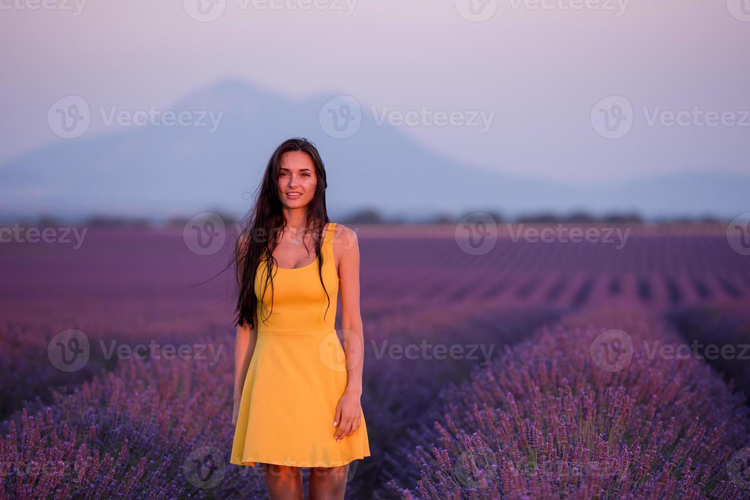 woman in yellow dress at lavender field photo