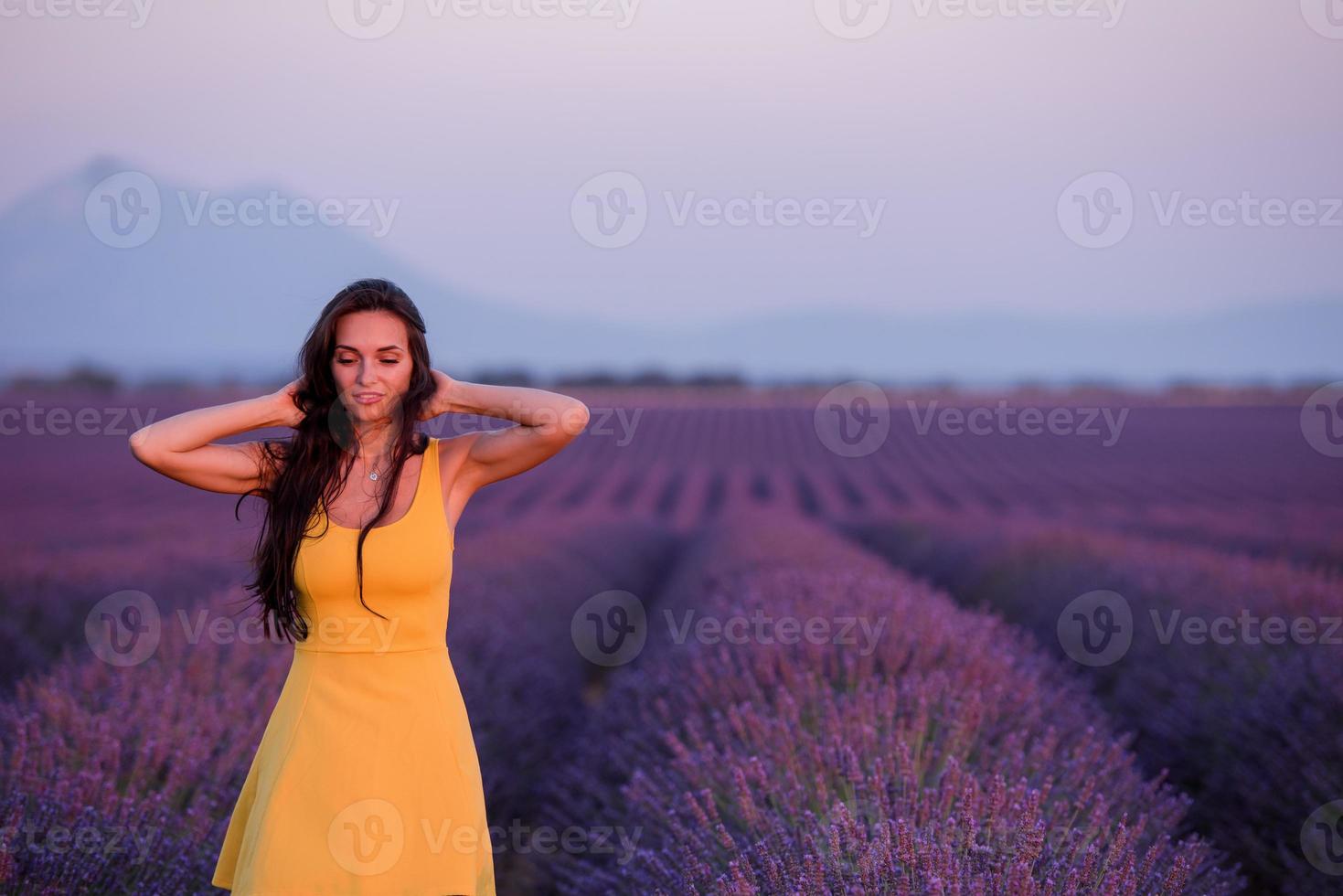 woman in yellow dress at lavender field photo