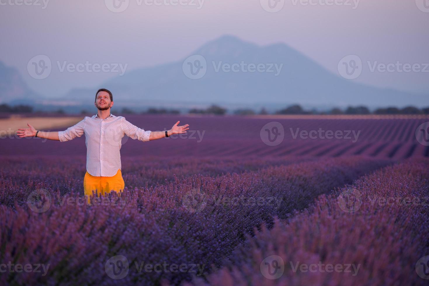 man in lavender flower field photo