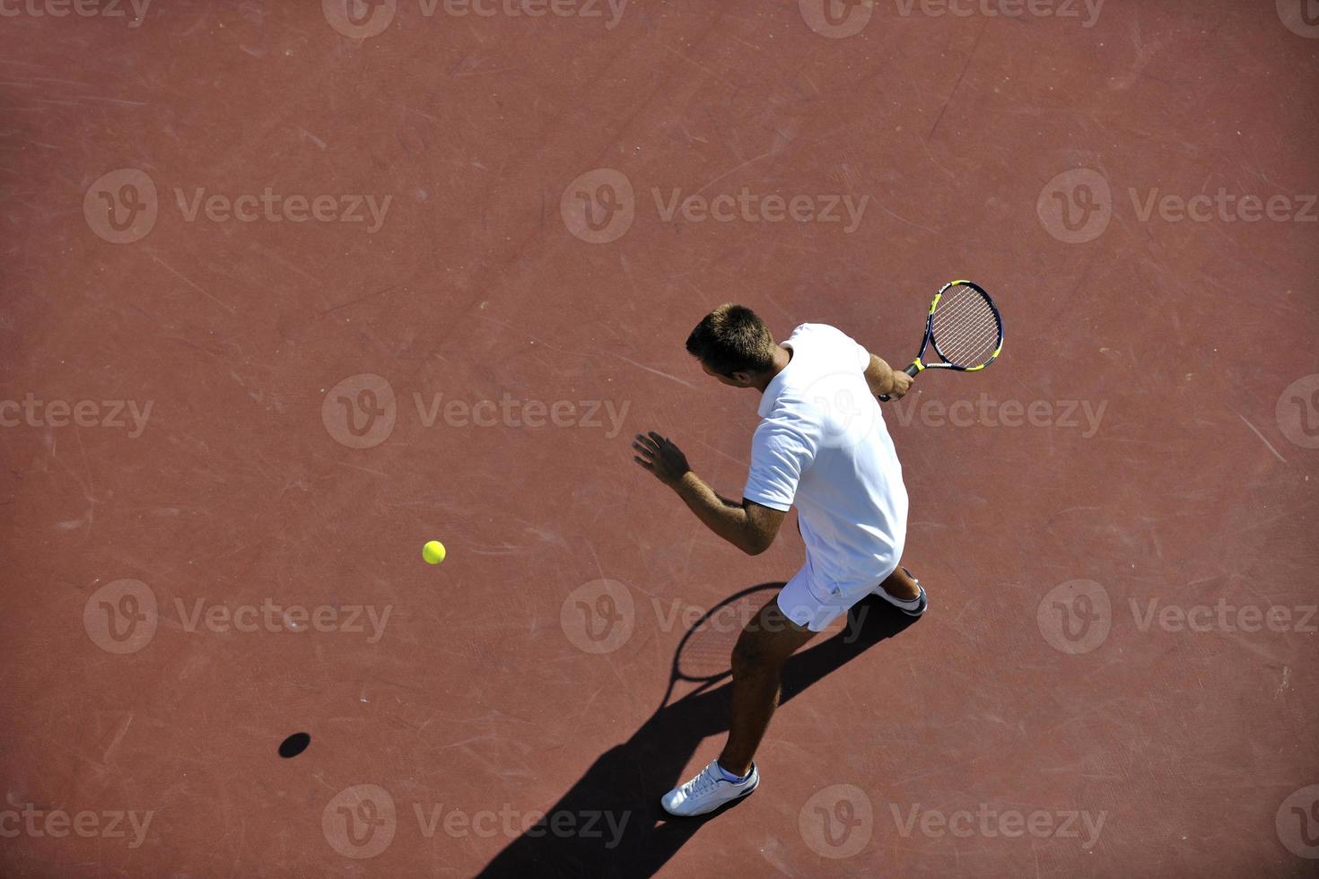 young man play tennis photo