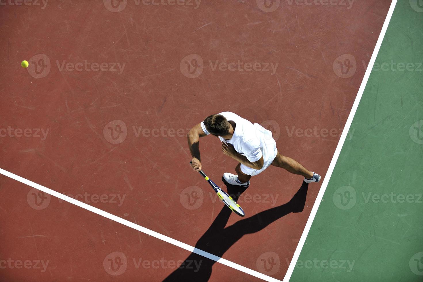 young man play tennis photo