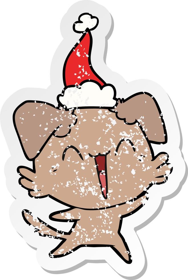 happy little dog distressed sticker cartoon of a wearing santa hat vector