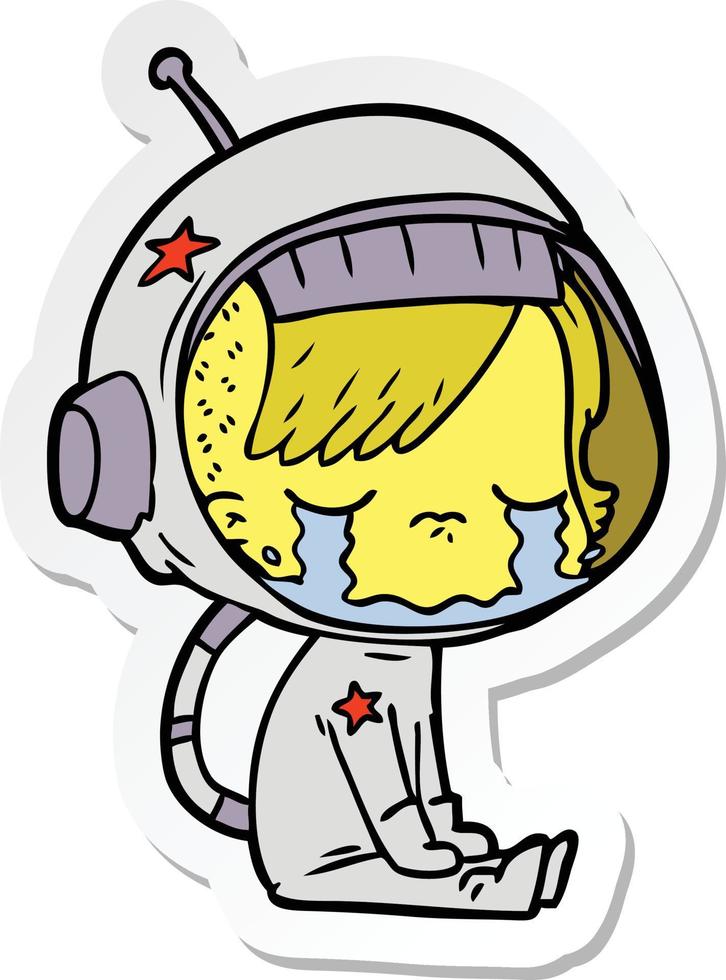 pegatina de una caricatura de una niña astronauta llorando sentada vector