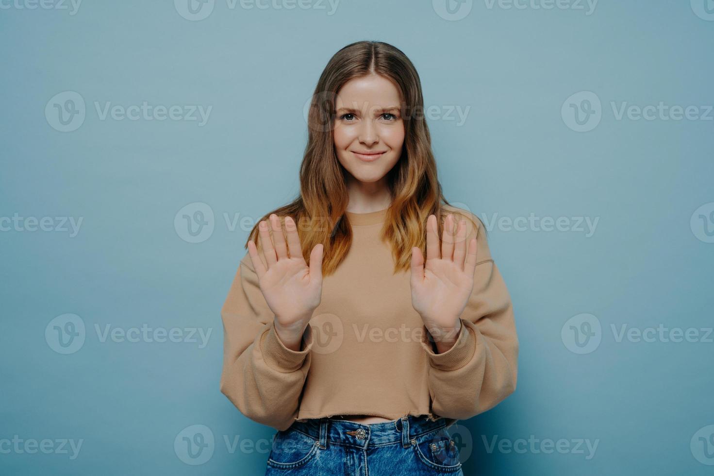 Young smiling brunette woman making no gesture photo